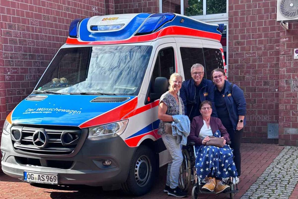 Gruppe vor dem Wünschewagen.jpg